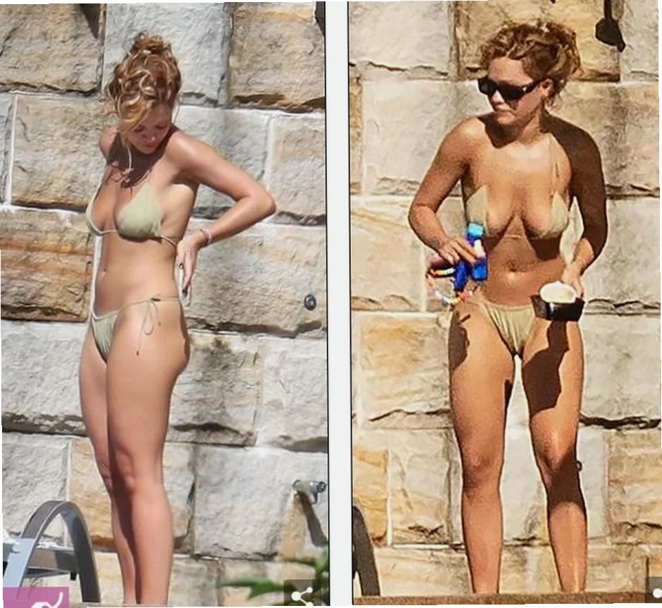 gái mặc bikini lộ hàng dạo phố biển